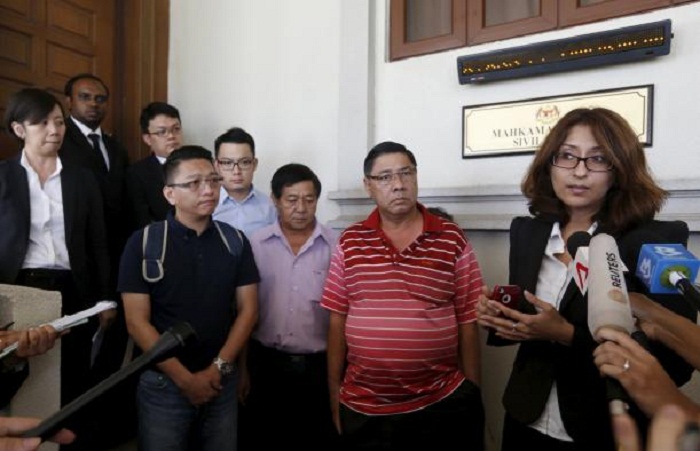Families of missing MH370 passengers sue airline as deadline nears